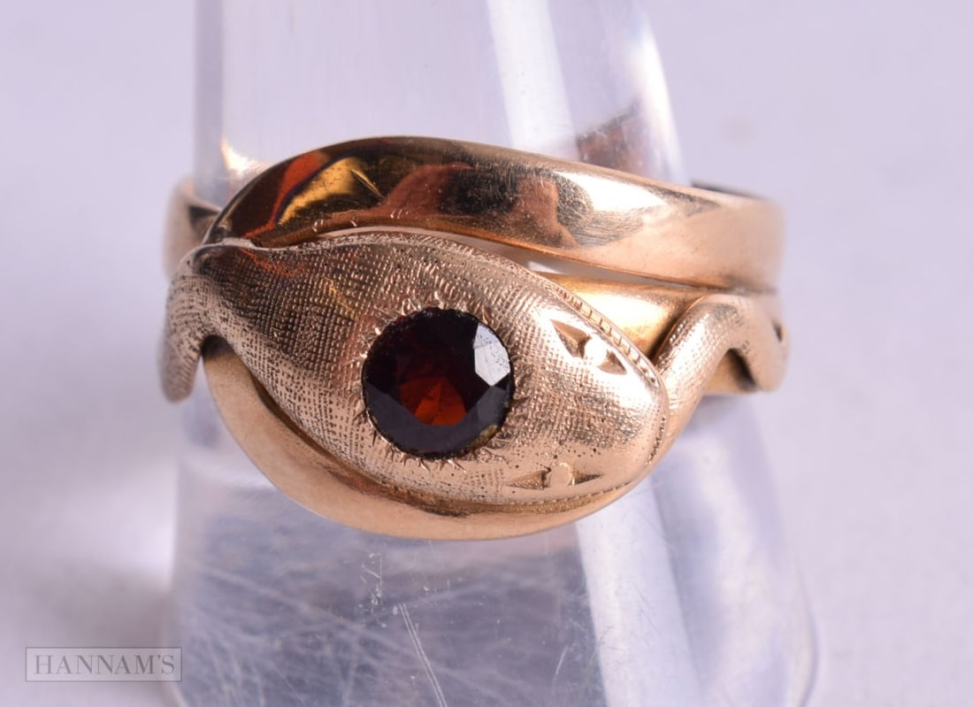 A 14CT GOLD AND RUBY SNAKE RING. 6.5 grams. V. (1 of 6)