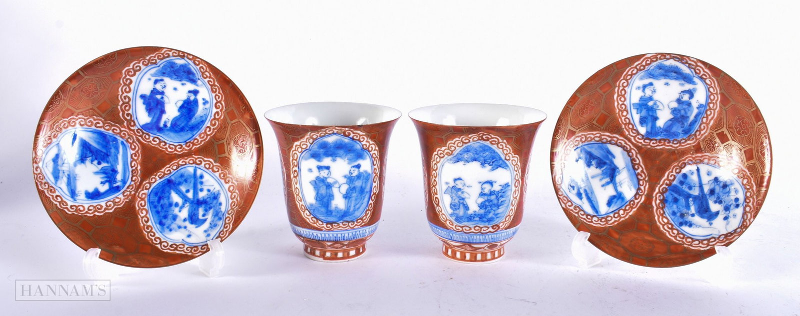 A PAIR OF 19TH CENTURY JAPANESE MEIJI PERIOD KUTANI PORCELAIN TEABOWLS AND SAUCERS painted with land: A PAIR OF 19TH CENTURY JAPANESE MEIJI PERIOD KUTANI PORCELAIN TEABOWLS AND SAUCERS painted with landscapes. 12 cm wide. (4)