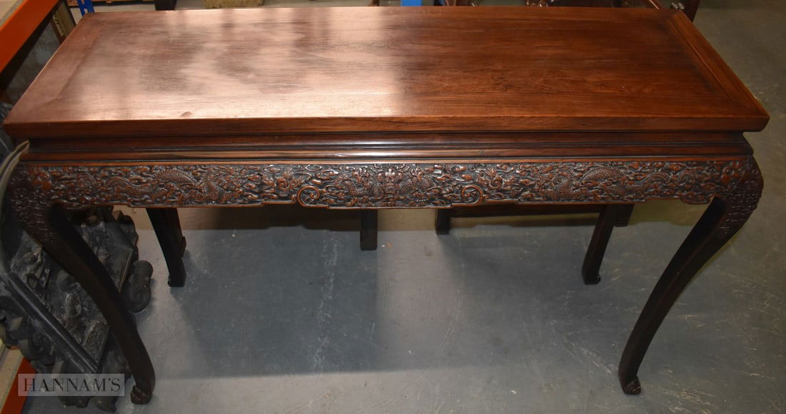 A FINE 19TH CENTURY CHINESE CARVED HARDWOOD DRAGON CONSOLE TABLE Qing, possibly Zitan. 85 cm x 125 c: A FINE 19TH CENTURY CHINESE CARVED HARDWOOD DRAGON CONSOLE TABLE Qing, possibly Zitan. 85 cm x 125 cm x 44 cm.
