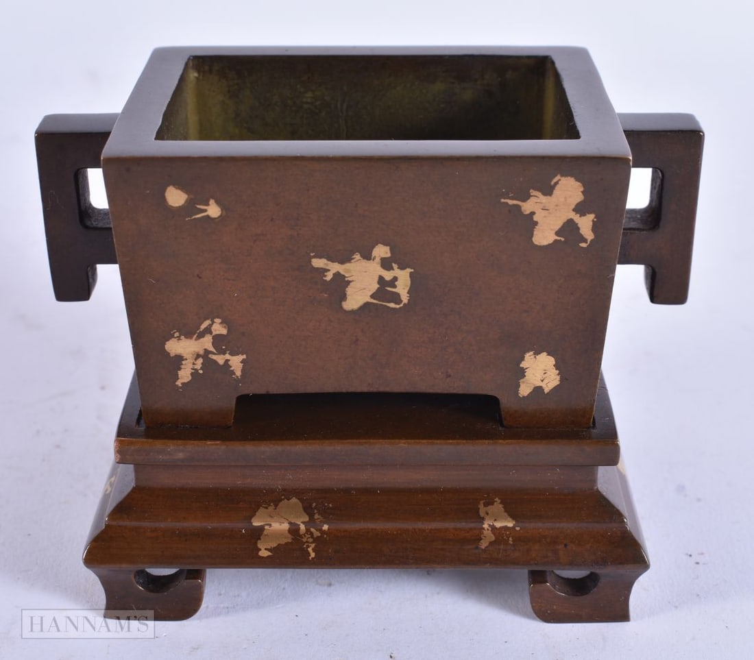 A CHINESE GOLD SPLASH BRONZE CENSER ON STAND. 10 cm wide. (1 of 3)