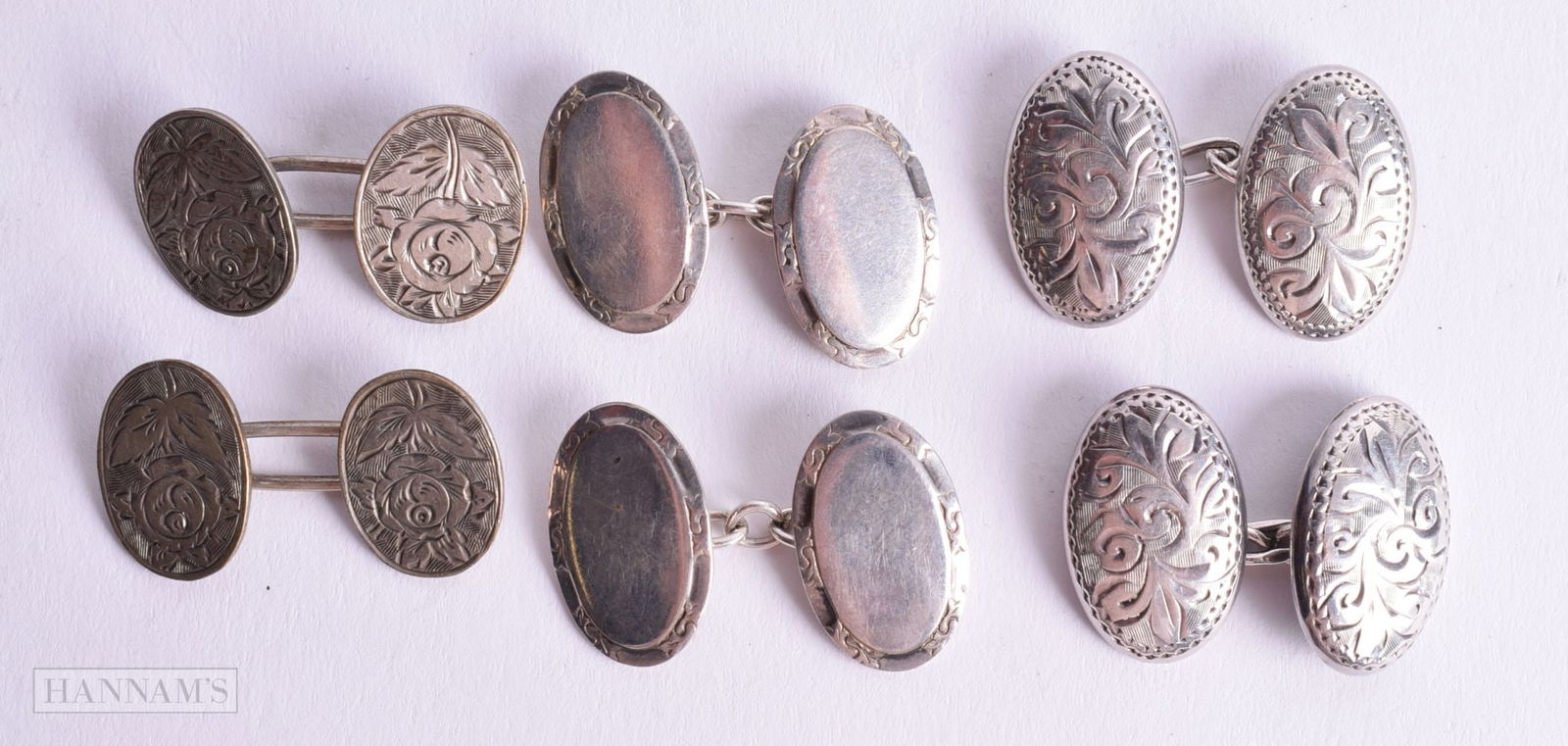 THREE PAIRS OF SILVER CUFFLINKS.  Stamped 925, Largest 1.9cm x 1.2cm, total weight 15.3g (3) (1 of 2)