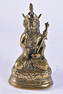 A CHINESE TIBETAN QING DYNASTY BRONZE FIGURE OF A SEATED BUDDHA modelled holding a vajra. 17 cm high