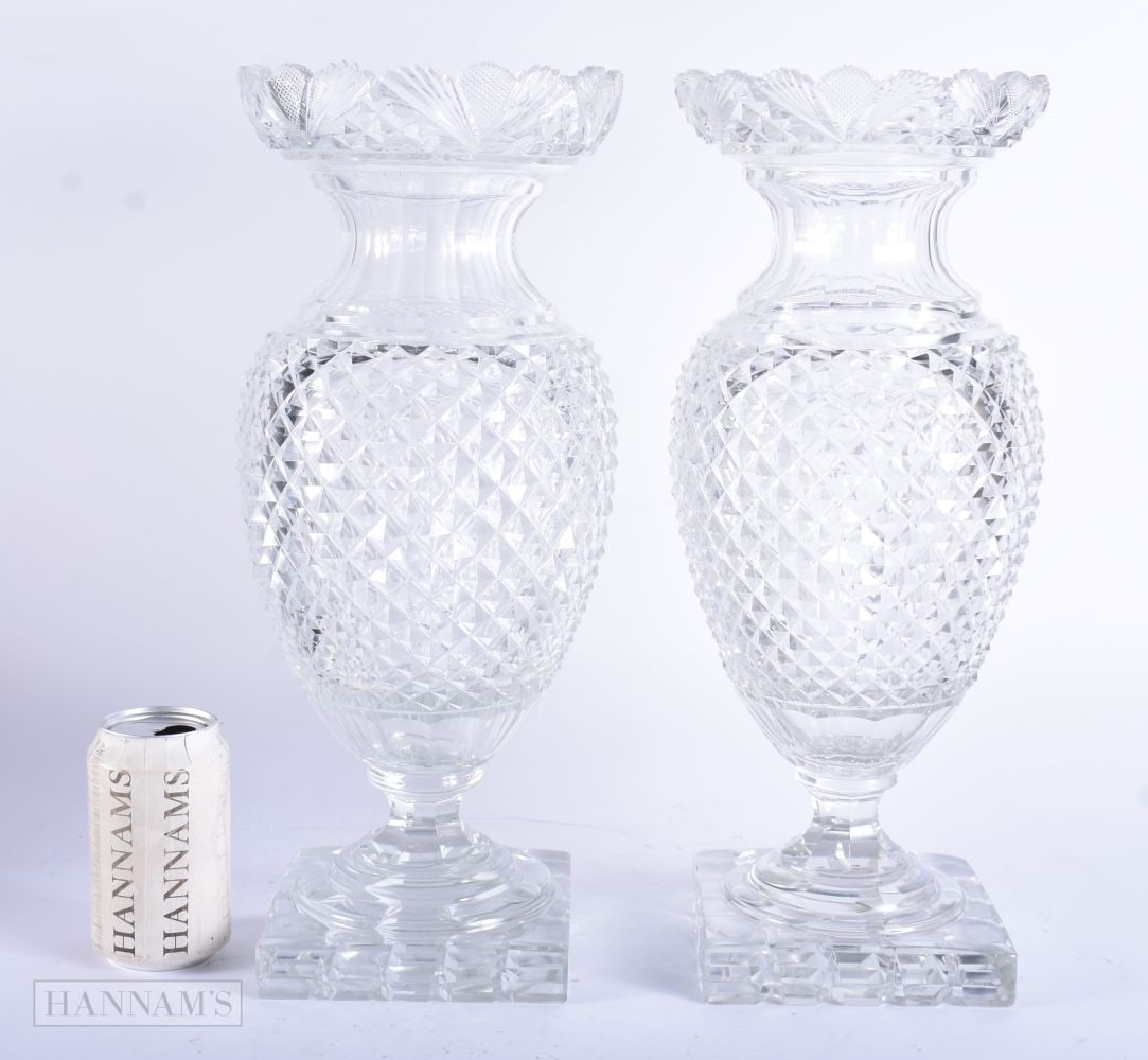 A LARGE PAIR OF ANTIQUE CUT GLASS COUNTRY HOUSE PEDESTAL VASES. 42 cm high.: A LARGE PAIR OF ANTIQUE CUT GLASS COUNTRY HOUSE PEDESTAL VASES. 42 cm high.