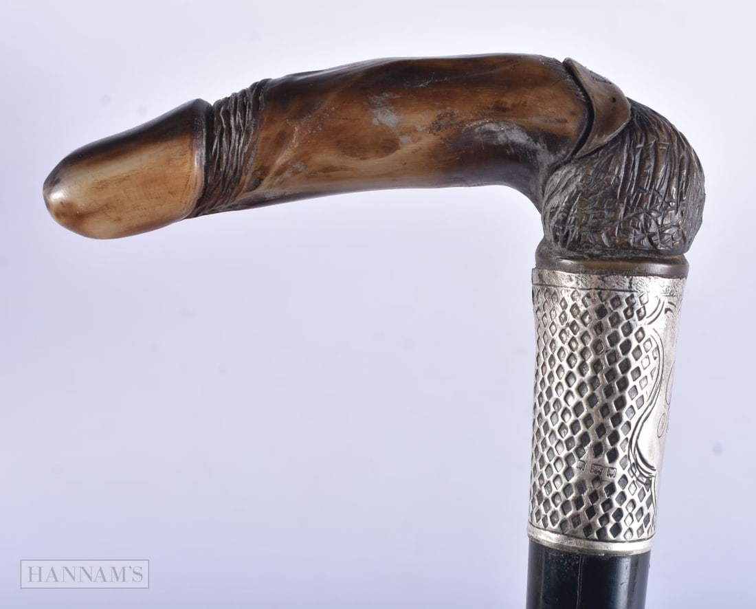 A RARE ANTIQUE CARVED EROTIC PHALLIC HORN WALKING CANE with silver mounts. 88 cm long.: A RARE ANTIQUE CARVED EROTIC PHALLIC HORN WALKING CANE with silver mounts. 88 cm long.