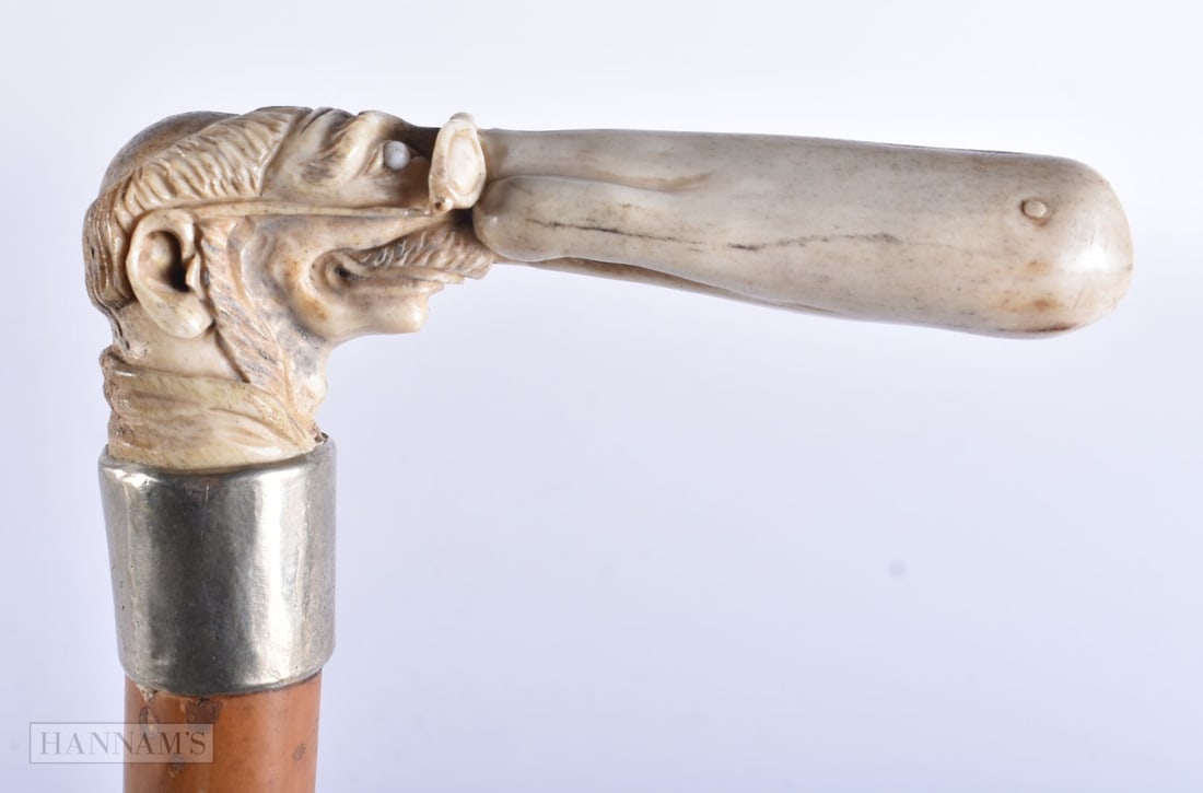 A RARE ANTIQUE CARVED HORN EROTIC PHALLIC NOSE WALKING CANE with white metal mounts. 85 cm long.: A RARE ANTIQUE CARVED HORN EROTIC PHALLIC NOSE WALKING CANE with white metal mounts. 85 cm long.