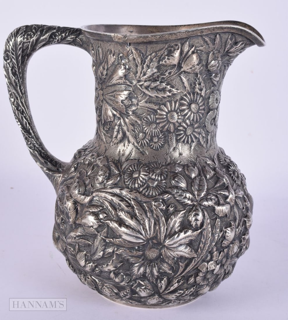 AN ANTIQUE S KIRK AND SON SILVER REPOUSSE JUG. 560 grams. 18 cm high. (1 of 8)