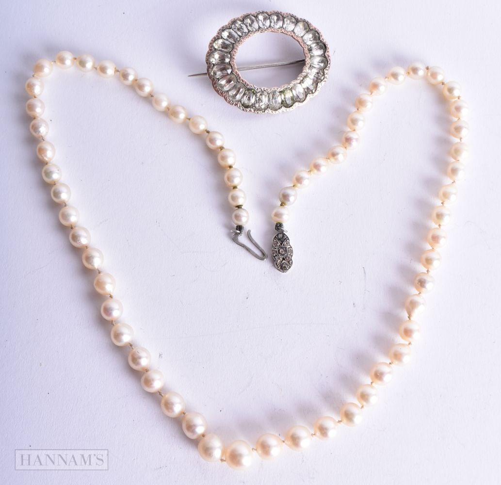 A GOLD AND PEARL NECKLACE together with a gold and silver brooch. 43 grams. Largest 55 cm long. (2): A GOLD AND PEARL NECKLACE together with a gold and silver brooch. 43 grams. Largest 55 cm long. (2)