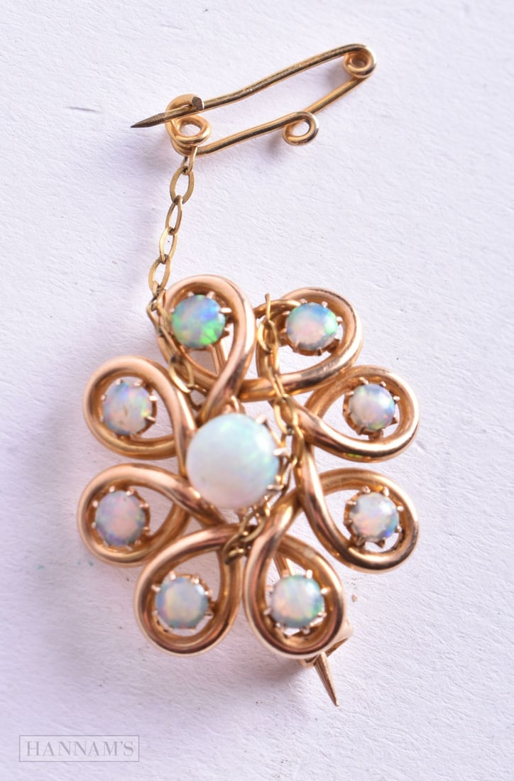 A VICTORIAN 15CT GOLD AND OPAL BROOCH. 4.2 grams. 2.25 cm x 2.5 cm. (1 of 2)