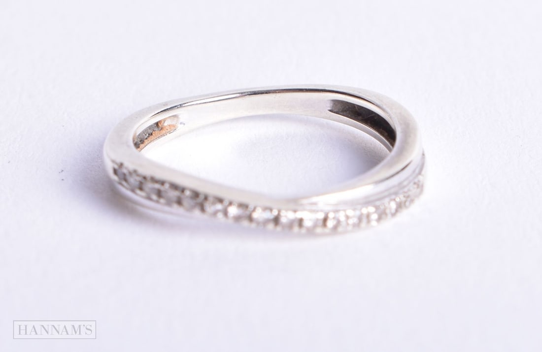 9ct gold diamond cross-over half eternity ring (2g). K. (1 of 2)