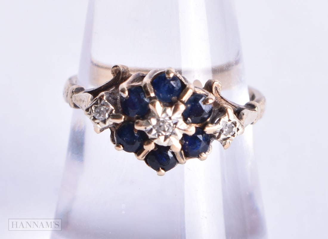 9ct gold diamond and sapphire halo ring (2.6g). N.: 9ct gold diamond and sapphire halo ring (2.6g). N.