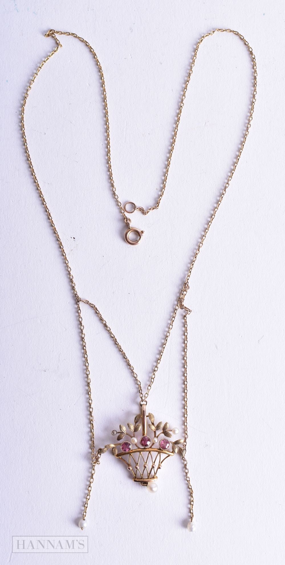9ct gold pink gemstone and seed pearl festoon flower basket necklace (4.4g). 44 cm long.: 9ct gold pink gemstone and seed pearl festoon flower basket necklace (4.4g). 44 cm long.