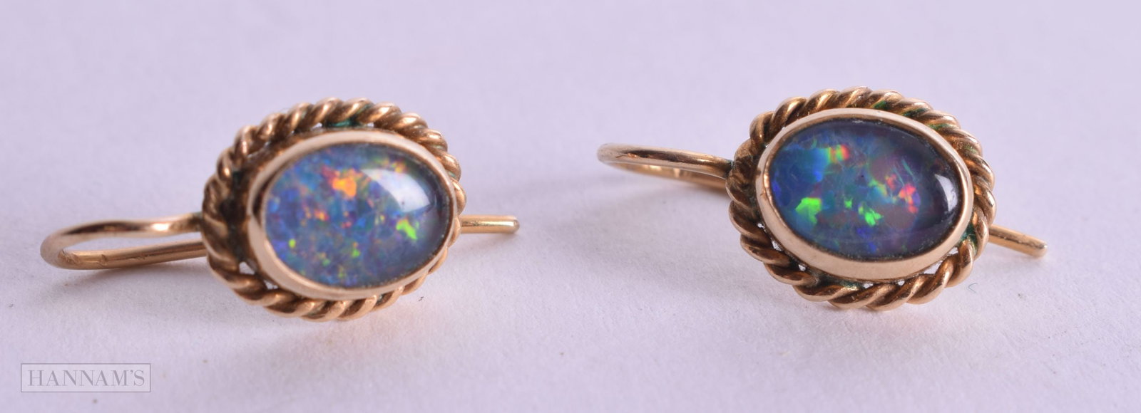 A PAIR OF GOLD AND OPAL EARRINGS. 2.3 grams. 1.5 cm x 1 cm.: A PAIR OF GOLD AND OPAL EARRINGS. 2.3 grams. 1.5 cm x 1 cm.