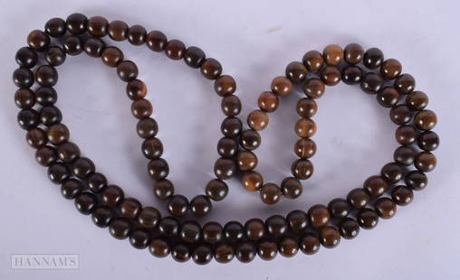 A 19TH CENTURY MIDDLE EASTERN ISLAMIC RHINOCEROS HORN PRAYER BEAD NECKLACE. 233 grams. 148 cm long.: A 19TH CENTURY MIDDLE EASTERN ISLAMIC RHINOCEROS HORN PRAYER BEAD NECKLACE. 233 grams. 148 cm long.