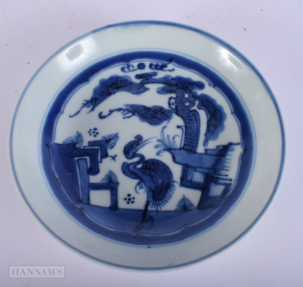 A 17TH CENTURY CHINESE BLUE AND WHITE PORCELAIN DISH Ming, painted with a bird within a rocky landsc (1 of 5)