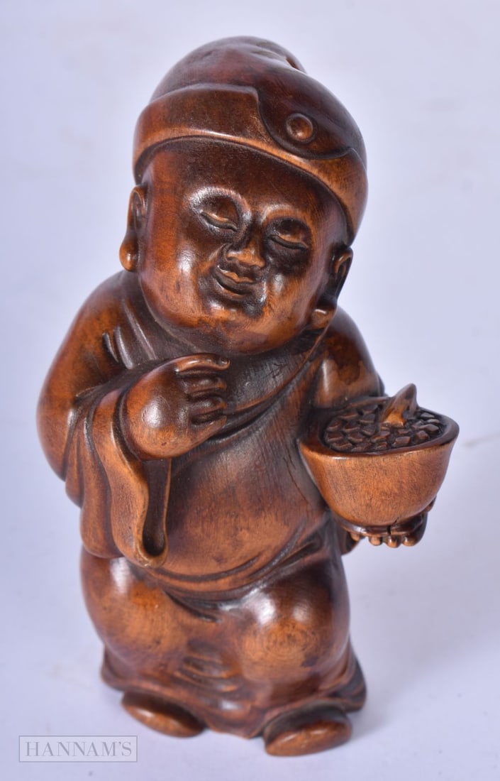 A Japanese carved hardwood child netsuke 10 x 5.5 x 4cm, wgt 84g: A Japanese carved hardwood child netsuke 10 x 5.5 x 4cm, wgt 84g