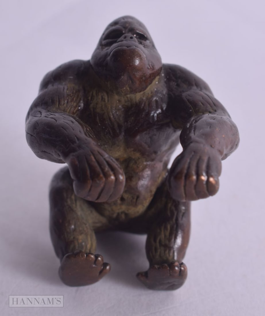 A JAPANESE BRONZE GORILLA. 130 grams. 4 cm x 4 cm. (1 of 3)