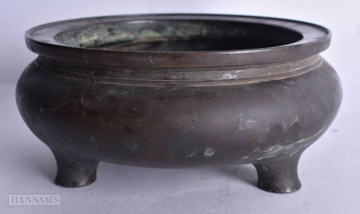 A CHINESE QING DYNASTY BRONZE CIRCULAR CENSER bearing unusual seal mark to base. 15 cm wide, interna: A CHINESE QING DYNASTY BRONZE CIRCULAR CENSER bearing unusual seal mark to base. 15 cm wide, internal width 12 cm.