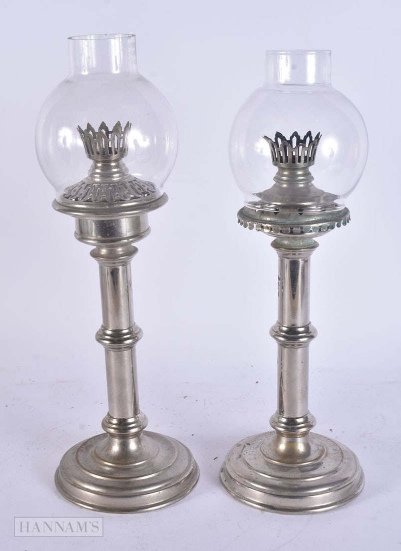 AN UNUSUAL ANTIQUE TIN CASED SILVER PLATED CAMPAIGN TRAVELLING OIL LAMPS. Case 55 cm x 27 cm.: AN UNUSUAL ANTIQUE TIN CASED SILVER PLATED CAMPAIGN TRAVELLING OIL LAMPS. Case 55 cm x 27 cm.
