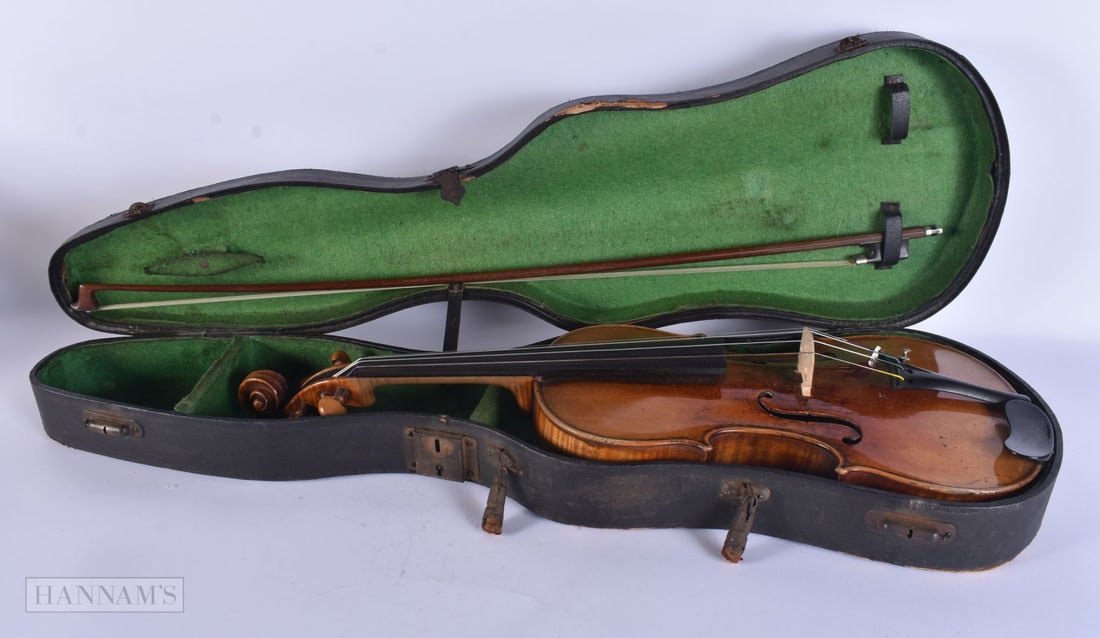 A VIOLIN with bow. 58 cm long, length of back inc hump 36.5 cm. (2): A VIOLIN with bow. 58 cm long, length of back inc hump 36.5 cm. (2)