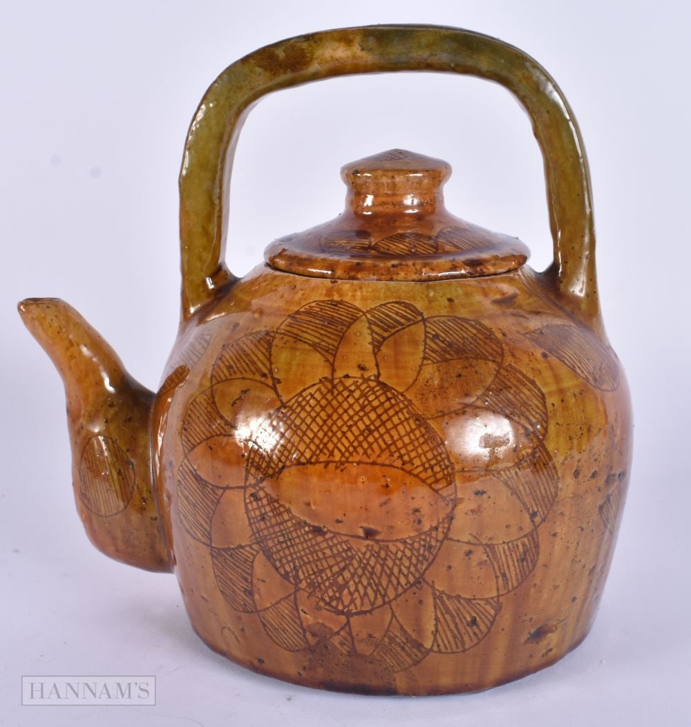 AN ANTIQUE WELSH POTTERY YELLOW GLAZED TEAPOT AND COVER decorated with flowers. 18cm x 18cm. (1 of 6)