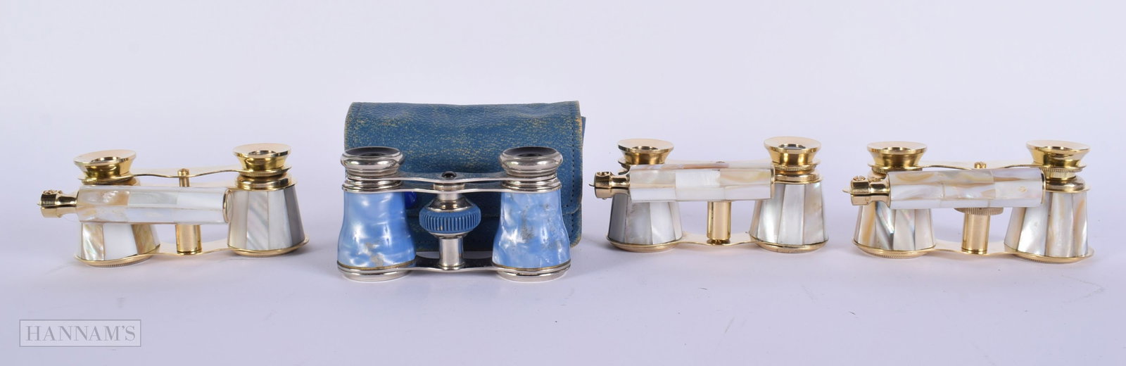 FOUR PAIRS OF MOTHER OF PEARL OPERA GLASSES. Largest 18cm wide. (4): FOUR PAIRS OF MOTHER OF PEARL OPERA GLASSES. Largest 18cm wide. (4)