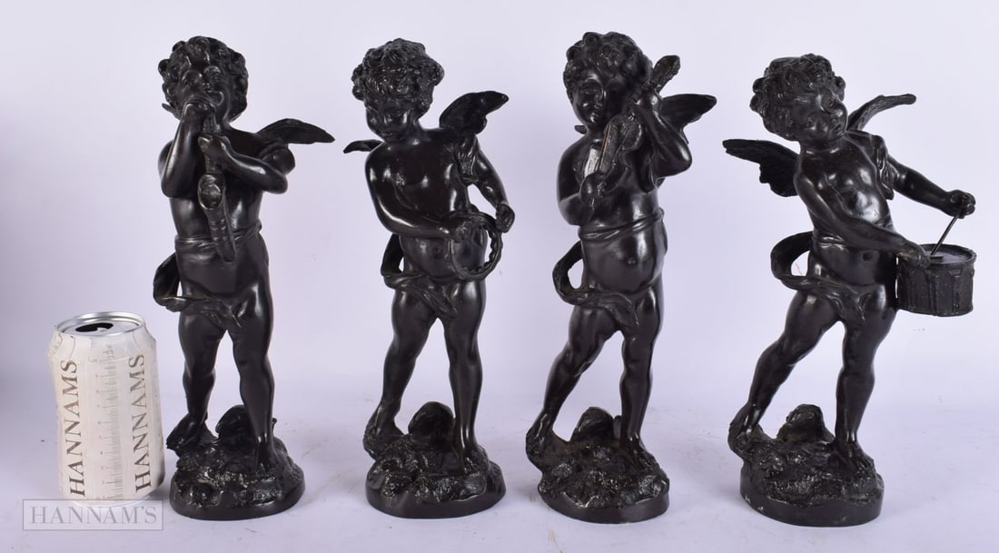 A SET OF FOUR FRENCH BRONZES OF MUSICAL PUTTI. 30 cm high.: A SET OF FOUR FRENCH BRONZES OF MUSICAL PUTTI. 30 cm high.