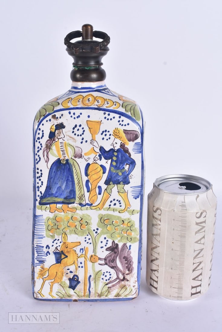 AN ANTIQUE FRENCH FAIENCE FLASK AND COVER. 36 cm high.: AN ANTIQUE FRENCH FAIENCE FLASK AND COVER. 36 cm high.