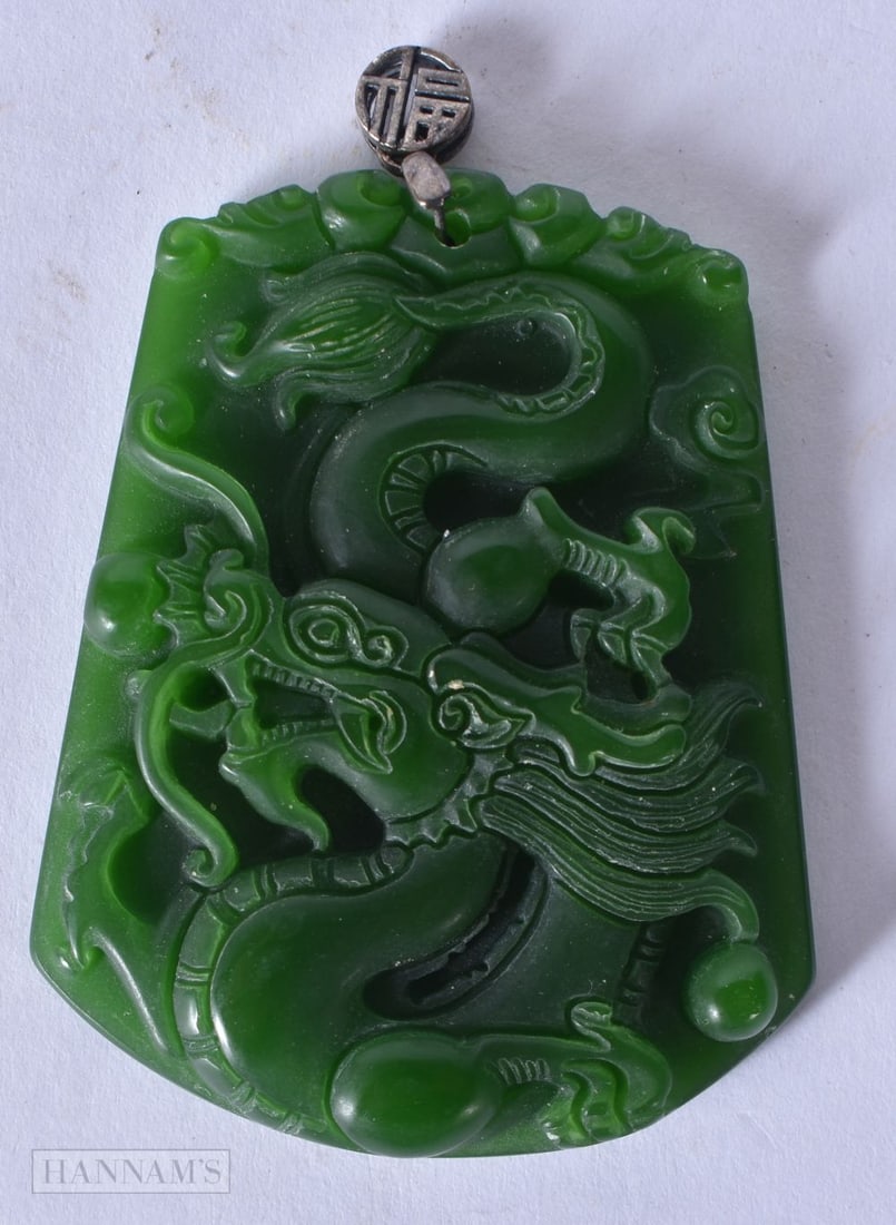 A Chinese silver top jade pendant, 26g, 6 x 4.2 cm.: A Chinese silver top jade pendant, 26g, 6 x 4.2 cm.
