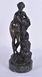 A 19TH CENTURY FRENCH BRONZE FIGURE OF A STANDING FEMALE modelled resting upon a column. 25.5 cm hig: A 19TH CENTURY FRENCH BRONZE FIGURE OF A STANDING FEMALE modelled resting upon a column. 25.5 cm high.