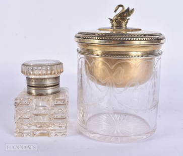 AN UNUSUAL CONTINENTAL SILVER AND ENAMEL DRESSING TABLE JAR AND COVER together with a glass inkwell.: AN UNUSUAL CONTINENTAL SILVER AND ENAMEL DRESSING TABLE JAR AND COVER together with a glass inkwell. Largest 14 cm high. (2)
