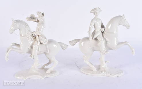 A PAIR OF GERMAN NYMPHENBURG PORCELAIN FIGURES modelled upon rearing horseback. 21 cm x 15 cm.: A PAIR OF GERMAN NYMPHENBURG PORCELAIN FIGURES modelled upon rearing horseback. 21 cm x 15 cm.