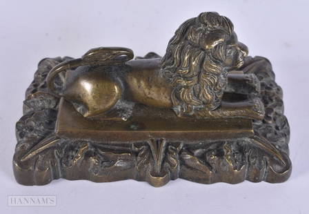 A REGENCY BRONZE LION PAPERWEIGHT. 11 cm x 6 cm.: A REGENCY BRONZE LION PAPERWEIGHT. 11 cm x 6 cm.