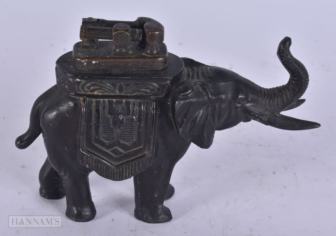 A VINTAGE ELEPHANT LIGHTER. 10 cm x 9 cm.: A VINTAGE ELEPHANT LIGHTER. 10 cm x 9 cm.