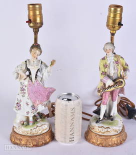 A PAIR OF ANTIQUE GERMAN PORCELAIN LAMPS. 33 cm high.: A PAIR OF ANTIQUE GERMAN PORCELAIN LAMPS. 33 cm high.