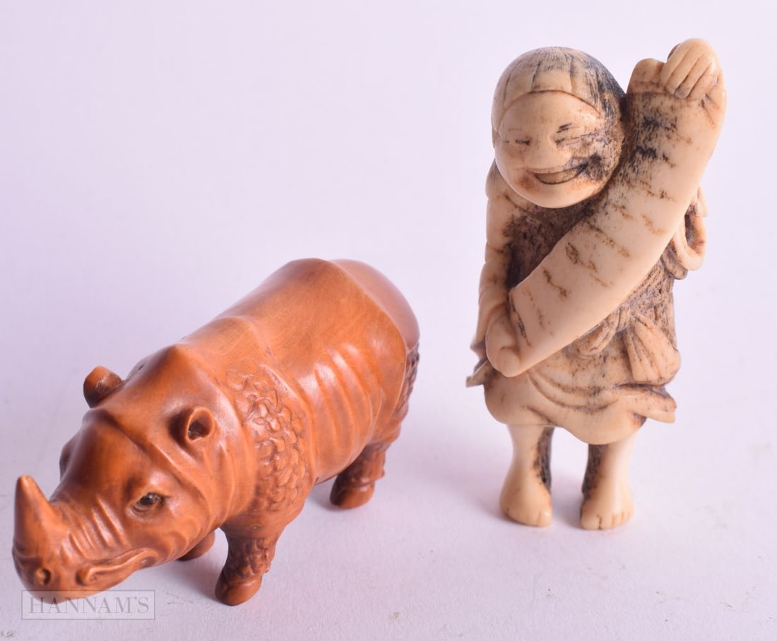 A 19TH CENTURY JAPANESE MEIJI PERIOD CARVED STAG ANTLER NETSUKE together with another. Largest 7.25 (1 of 3)