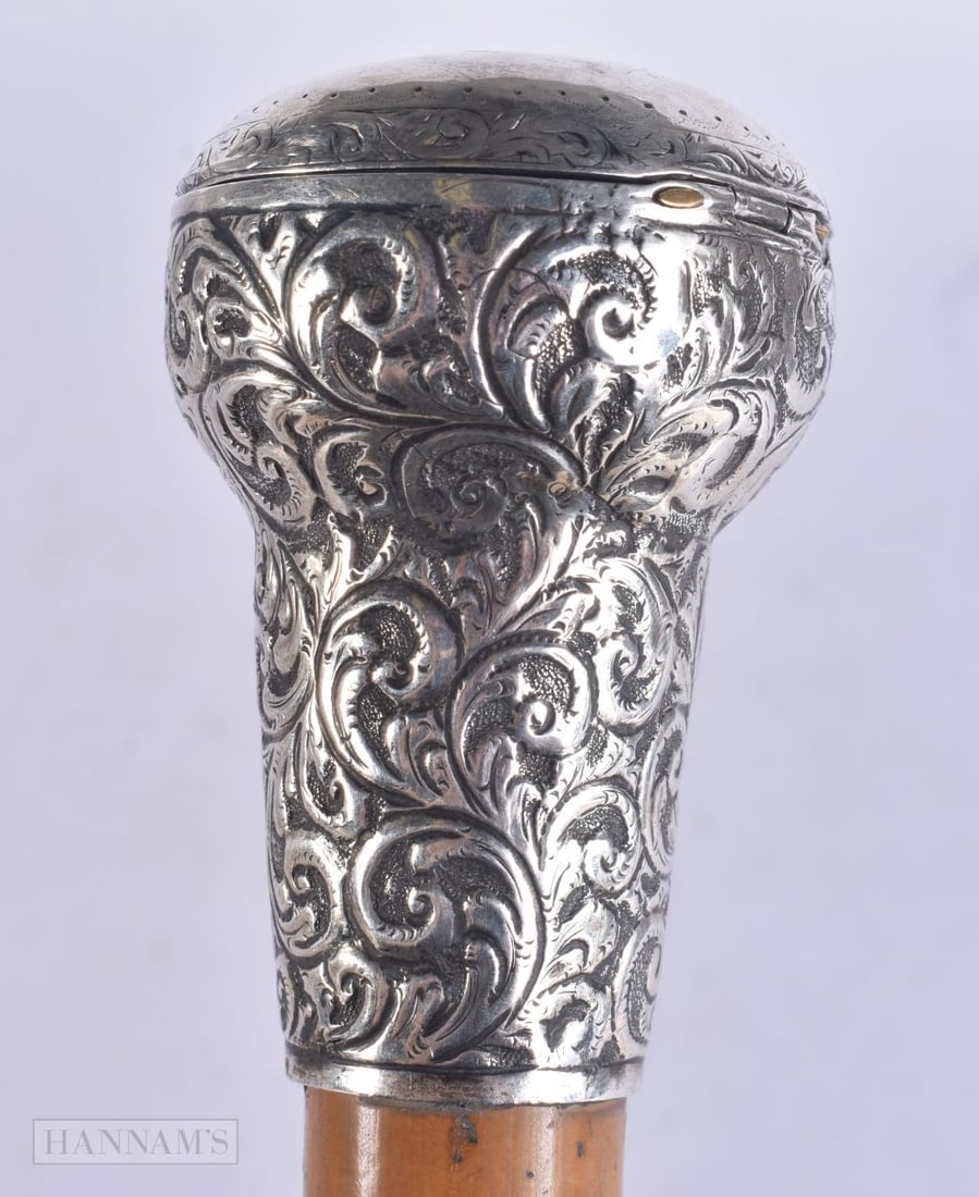 A VICTORIAN SILVER MOUNTED COMBINATION REPOUSSE WALKING CANE. 88 cm long. (1 of 5)