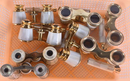 EIGHT PAIRS OF MOTHER OF PEARL OPERA GLASSES. Largest 18 cm wide extended. (8): EIGHT PAIRS OF MOTHER OF PEARL OPERA GLASSES. Largest 18 cm wide extended. (8)