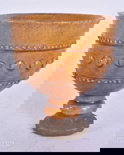 A CHINESE YELLOW GLAZED POTTERY CUP. 11 cm high.: A CHINESE YELLOW GLAZED POTTERY CUP. 11 cm high.
