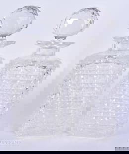 A PAIR OF ANTIQUE CUT GLASS DECANTERS AND STOPPERS. 22.5 cm high.: A PAIR OF ANTIQUE CUT GLASS DECANTERS AND STOPPERS. 22.5 cm high.