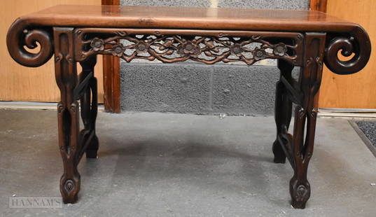 A 19TH CENTURY CHINESE LOW SCROLLING HARDWOOD TABLE probably Huanghuali. 92 cm x 50 cm x 38 cm.: A 19TH CENTURY CHINESE LOW SCROLLING HARDWOOD TABLE probably Huanghuali. 92 cm x 50 cm x 38 cm.