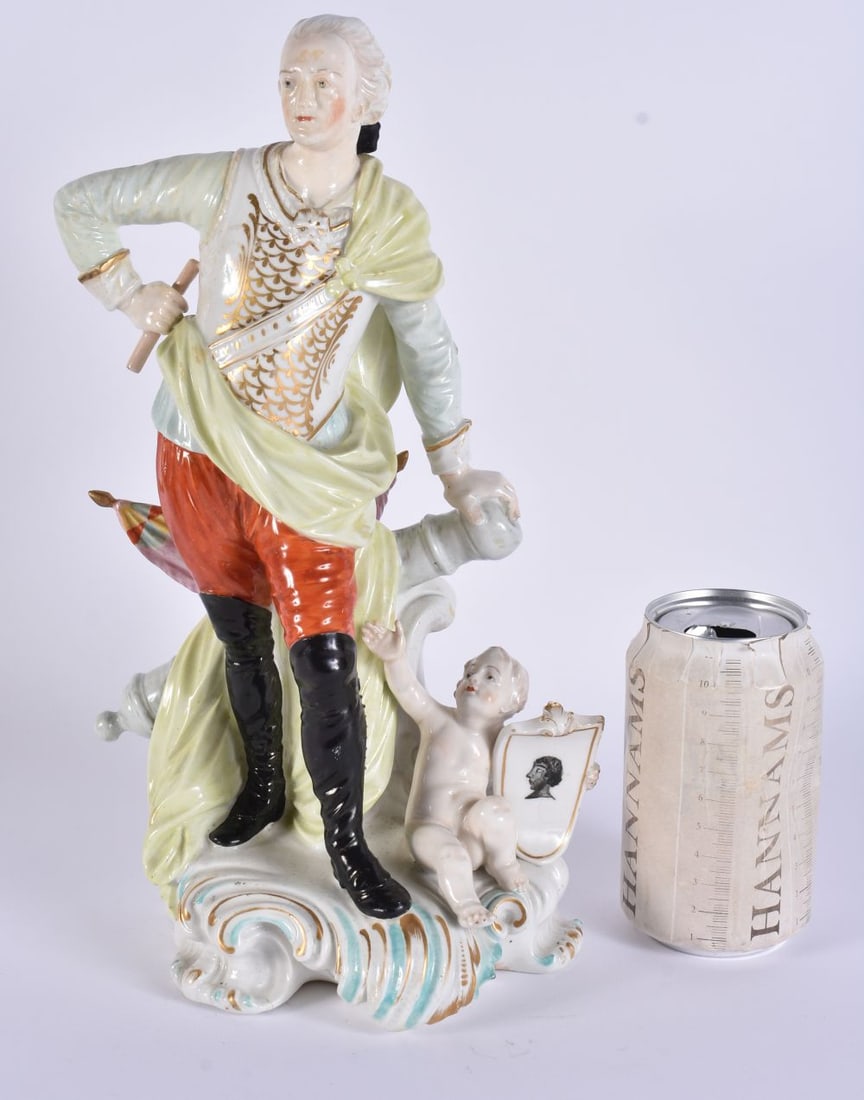 A LARGE EARLY 19TH CENTURY DERBY PORCELAIN FIGURE OF A MALE modelled in yellow embellished robes, st: A LARGE EARLY 19TH CENTURY DERBY PORCELAIN FIGURE OF A MALE modelled in yellow embellished robes, standing over a child holding a shield. 33 cm x 14 cm.