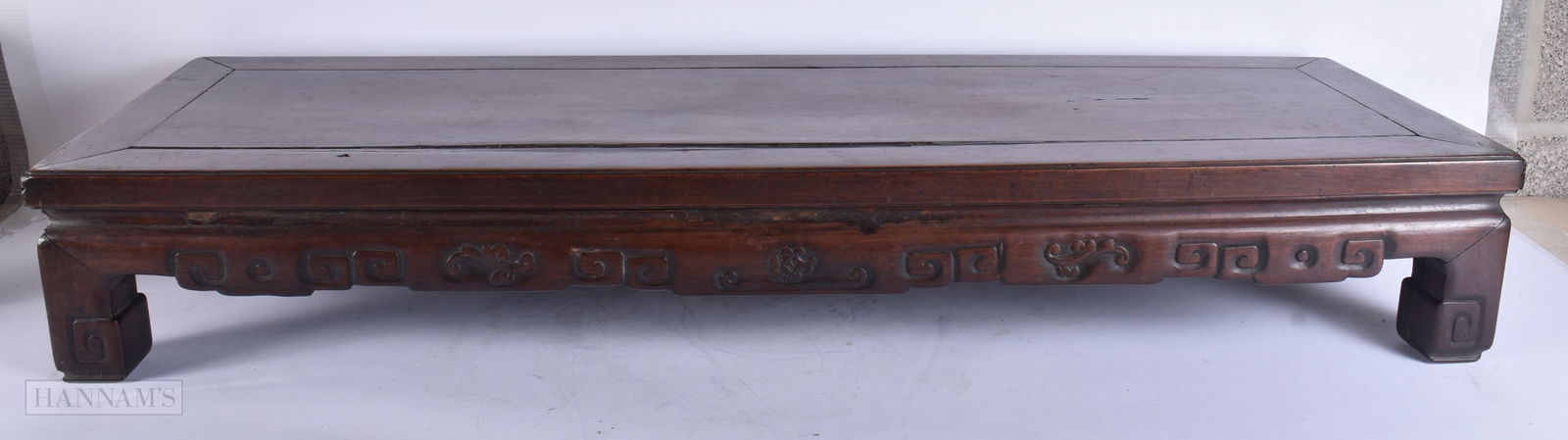 A 19TH CENTURY CHINESE CARVED HARDWOOD LOW TABLE Qing. 98 cm x 32 cm x 15 cm.: A 19TH CENTURY CHINESE CARVED HARDWOOD LOW TABLE Qing. 98 cm x 32 cm x 15 cm.