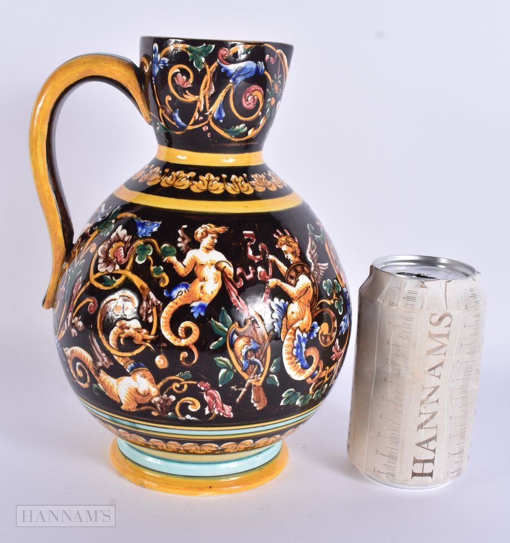 AN ITALIAN MAJOLICA POTTERY JUG. 23 cm high.: AN ITALIAN MAJOLICA POTTERY JUG. 23 cm high.