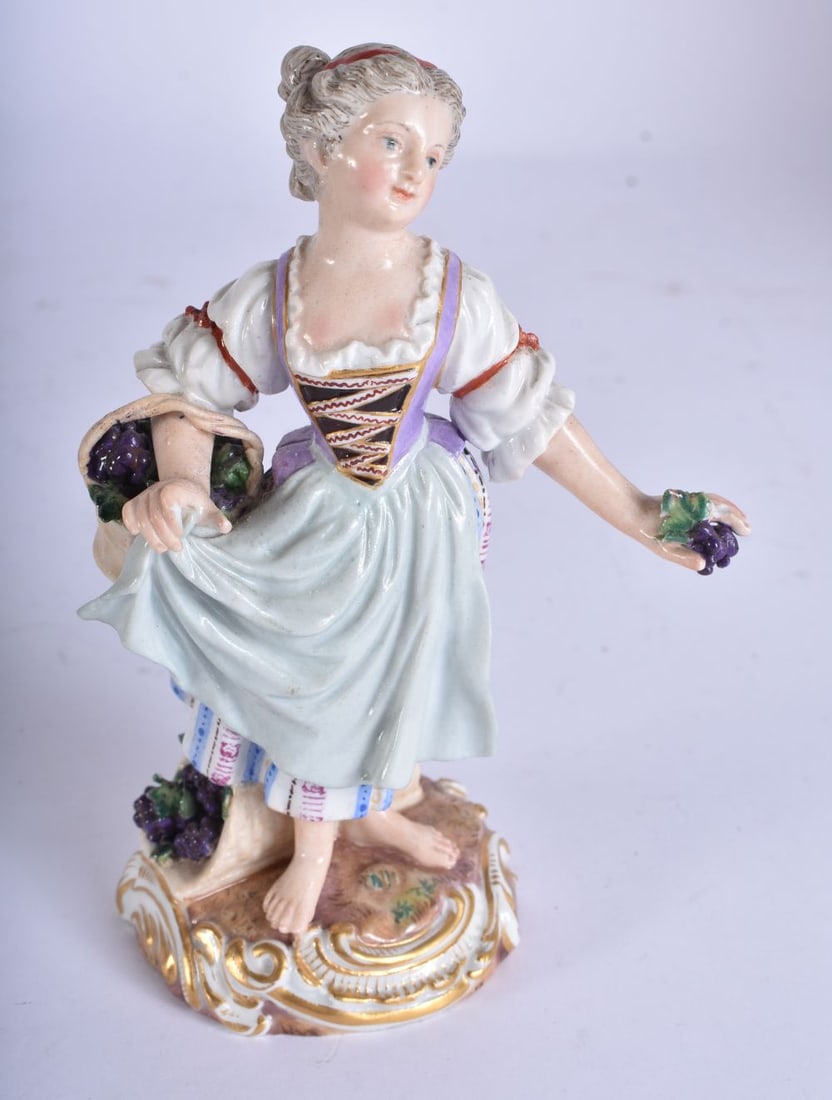 Late 19th century Meissen figure of a girl carrying a basket of grapes, crossed swords mark in blue,: Late 19th century Meissen figure of a girl carrying a basket of grapes, crossed swords mark in blue, 11.7cm high