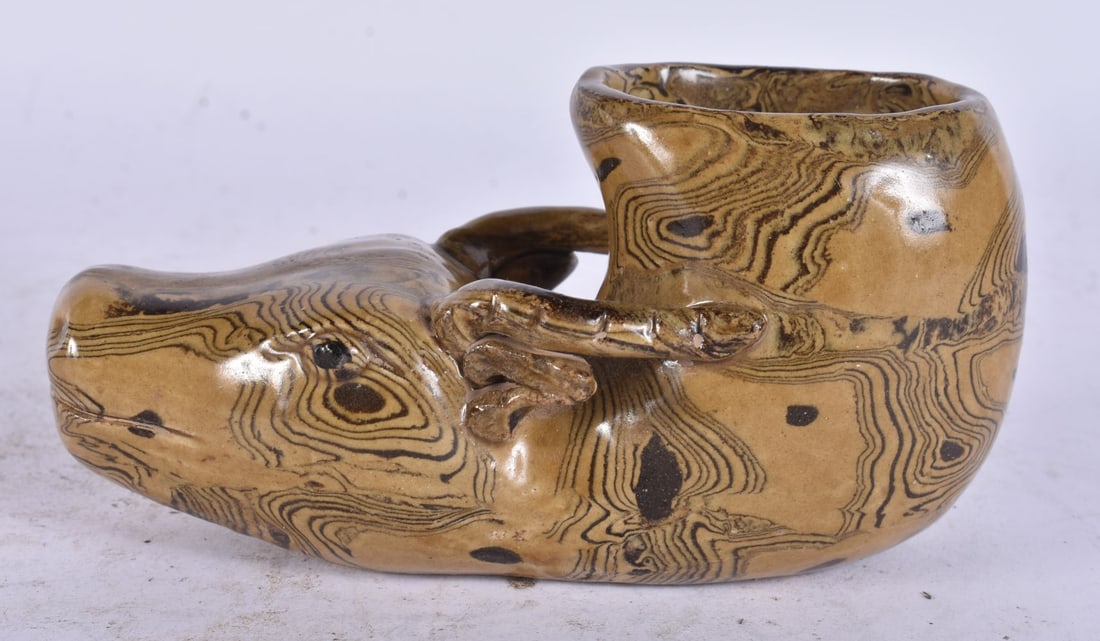 A CHINESE TREACLE GLAZED POTTERY LIBATION CUP. 15 cm wide. (1 of 4)