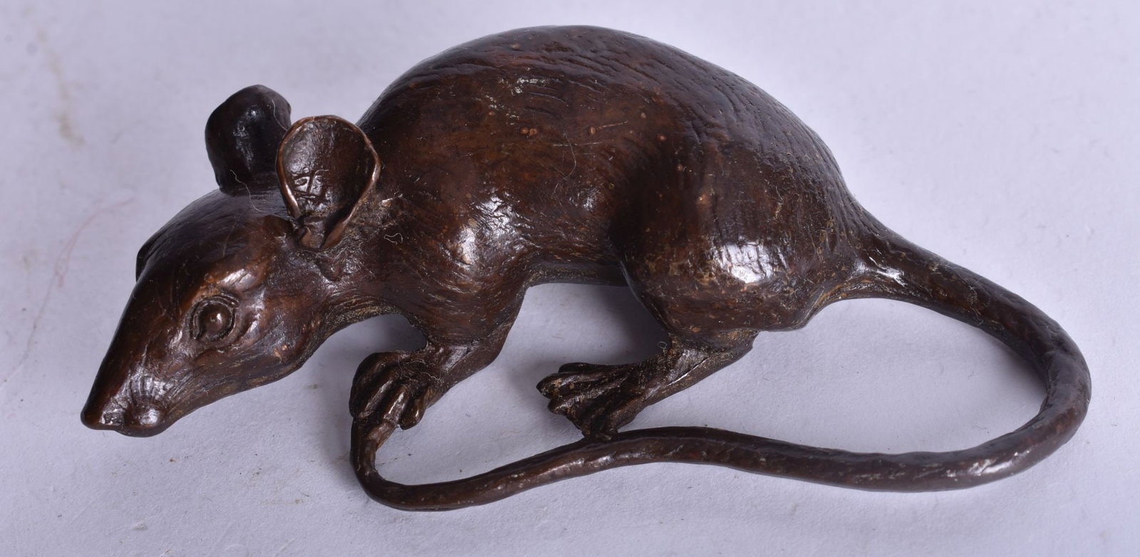 A JAPANESE BRONZE RAT OKIMONO. 166 grams. 8.5 cm x 4.25 cm.: A JAPANESE BRONZE RAT OKIMONO. 166 grams. 8.5 cm x 4.25 cm.