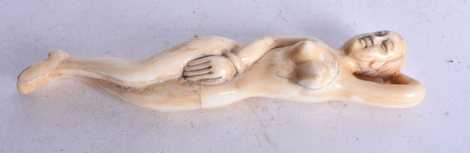 A JAPANESE BONE MEDICINE DOLL. 44.1 grams. 13 cm long.: A JAPANESE BONE MEDICINE DOLL. 44.1 grams. 13 cm long.