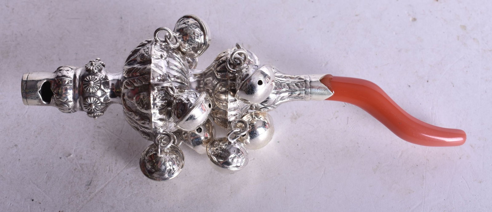 A Babies Rattle with a Coral Teether, Bells and Whistles. 14cm x 5 cm, weight 62.8g: A Babies Rattle with a Coral Teether, Bells and Whistles. 14cm x 5 cm, weight 62.8g