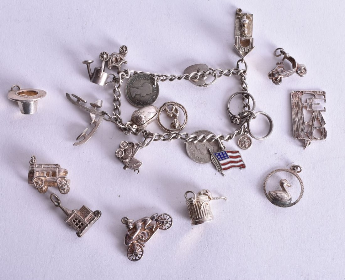A SILVER CHARM BRACELET WITH 12 CHARMS, & A FURTHER 8 SILVER CHARMS, total weight 62g (qty): A SILVER CHARM BRACELET WITH 12 CHARMS, & A FURTHER 8 SILVER CHARMS, total weight 62g (qty)