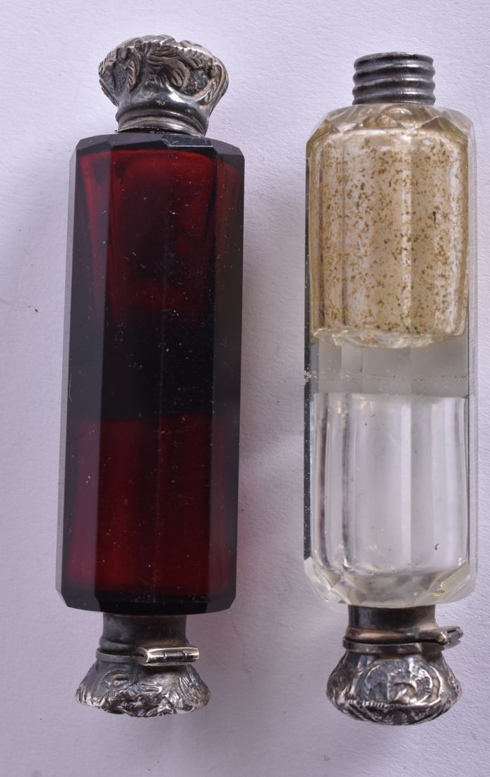 TWO 19TH CENTURY SILVER MOUNTED PERFUME DOUBLE ENDED BOTTLES.  Largest 9.5 cm long,(2) (1 of 2)
